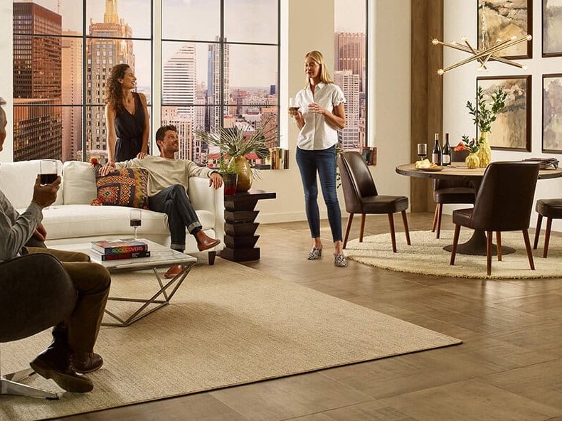 Family spending time in living room with beautiful area rug